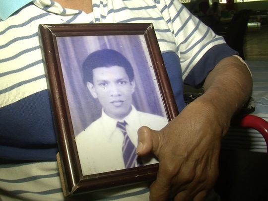 635925961820427950 Edward Alwis holding a picture of himself a couple of years after arriving at Hendala Image by Ross Velton Sri Lanka 2015