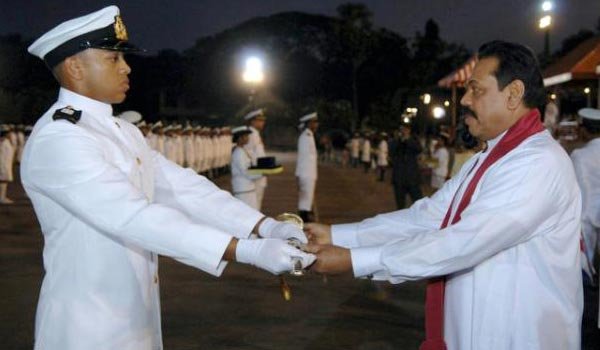 AFP/AFP/File - Mahinda Rajapakse (R), pictured here in 2009 when he was Sri Lanka&#039;s president, with his son Yoshitha Rajapakse, who has served in the Navy and also represented his country at the Rugby Sevens