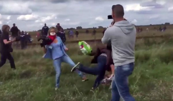 Hungarian journalist fired after kicking refugees on video