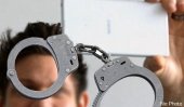 Arrested over taking picture of ballot paper