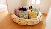 Rest in a nest : Wooden bed with soft egg-shaped pillows