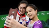 North &amp; South Korean gymnasts pose for Olympic selfie