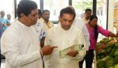 Rajitha opens organic store of Bandula’s son