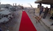 Activists roll out red carpet through Gaza ruins (Video)